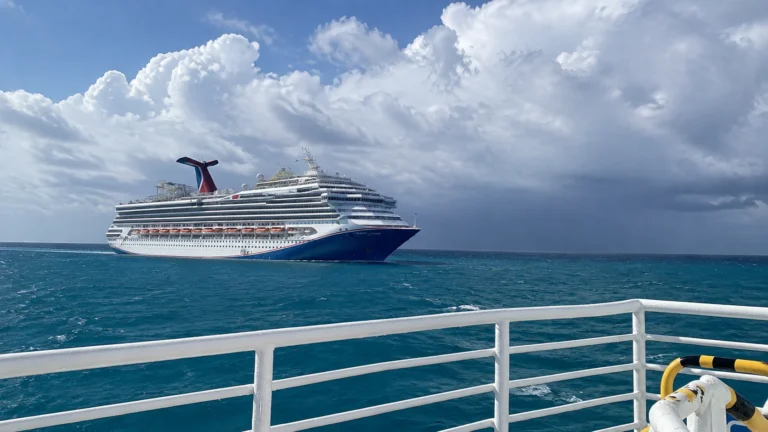 Carnival Sunshine sailing under cloudy skies