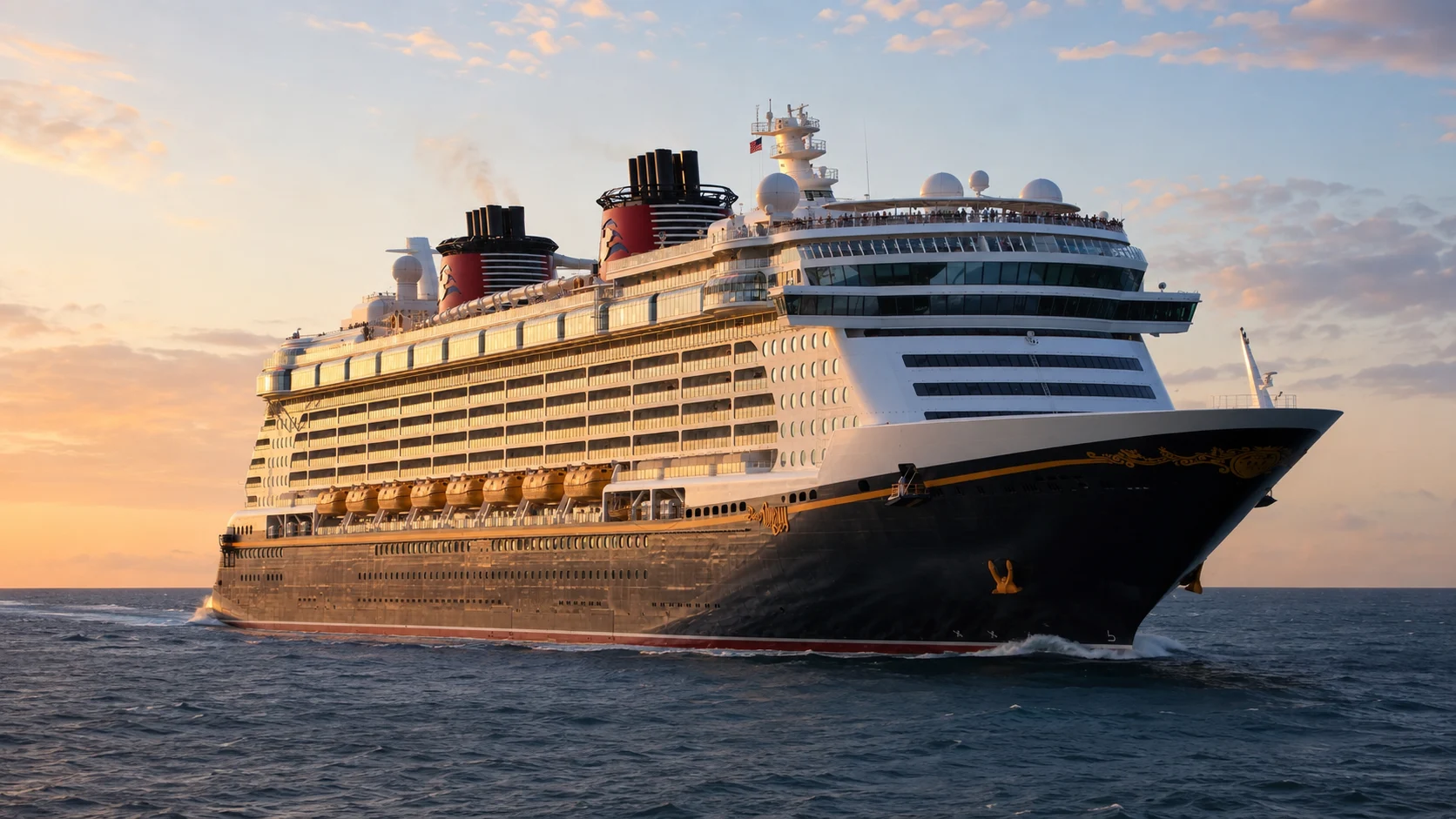 Disney Dream sailing across calm water at sunset