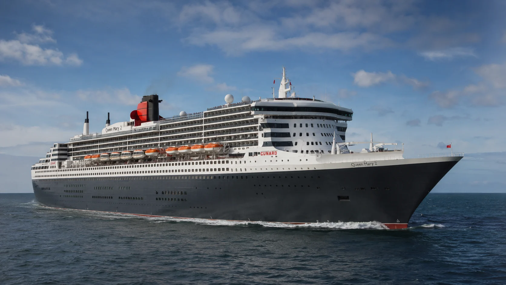 Queen Mary 2 sailing across open water beneath scattered clouds