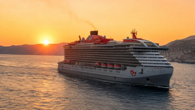 Resilient Lady sailing past Greek islands at sunset