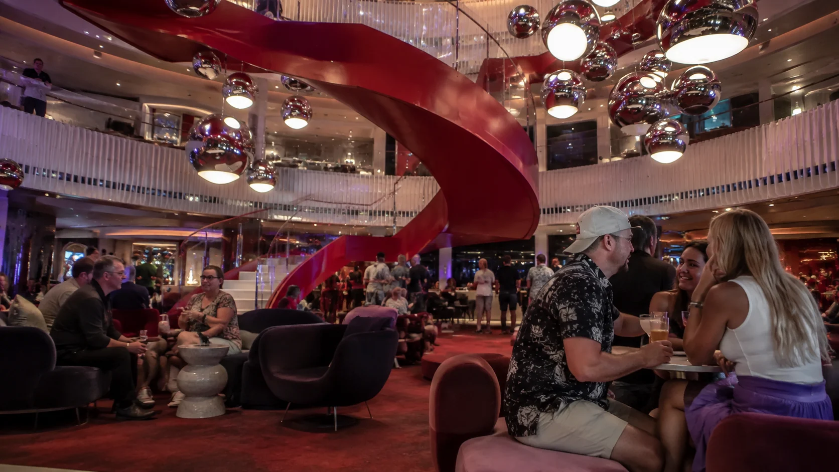 Red spiral staircase in the Roundabout atrium aboard Brilliant Lady