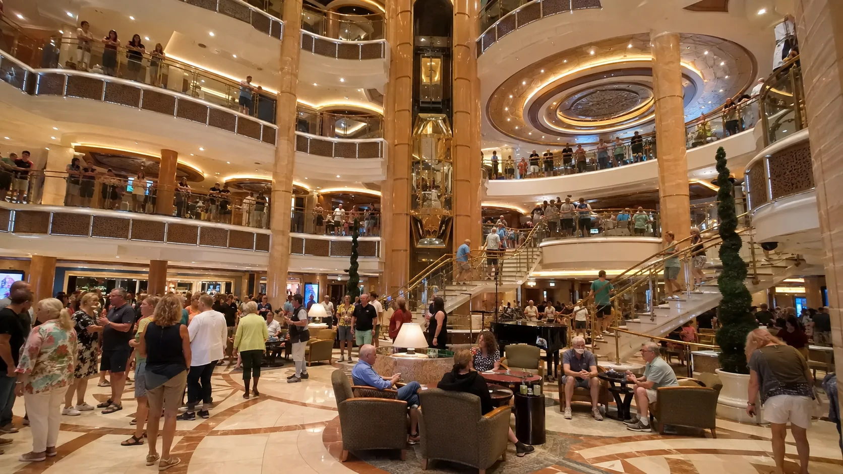 Guests gathered in the multi-level Piazza aboard Caribbean Princess