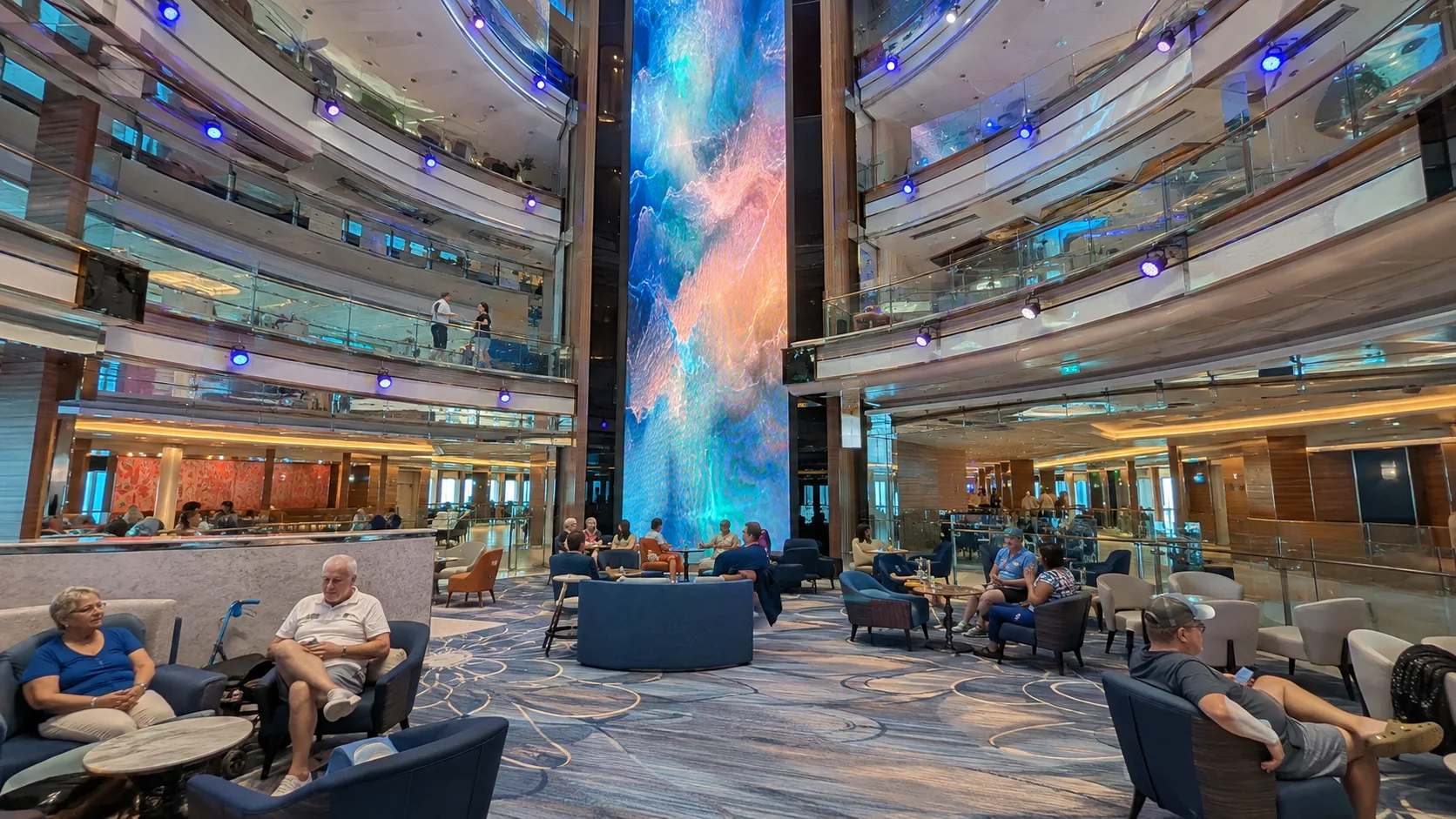 Tall digital art display in the atrium aboard Carnival Horizon