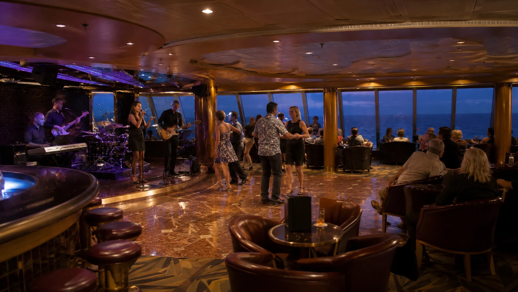 Guests enjoying music in Ocean Plaza aboard Carnival Sunshine