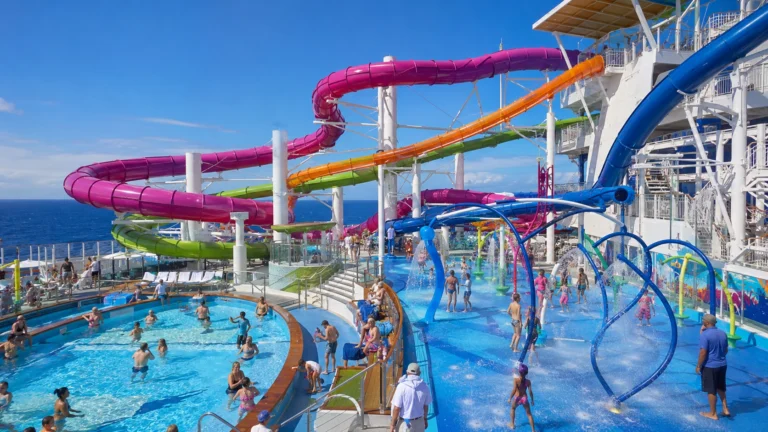 Cruise ship aqua park with pink, yellow, and blue waterslides