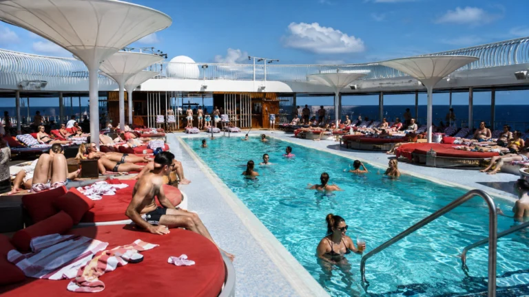 Guests relaxing around the pool aboard Brilliant Lady