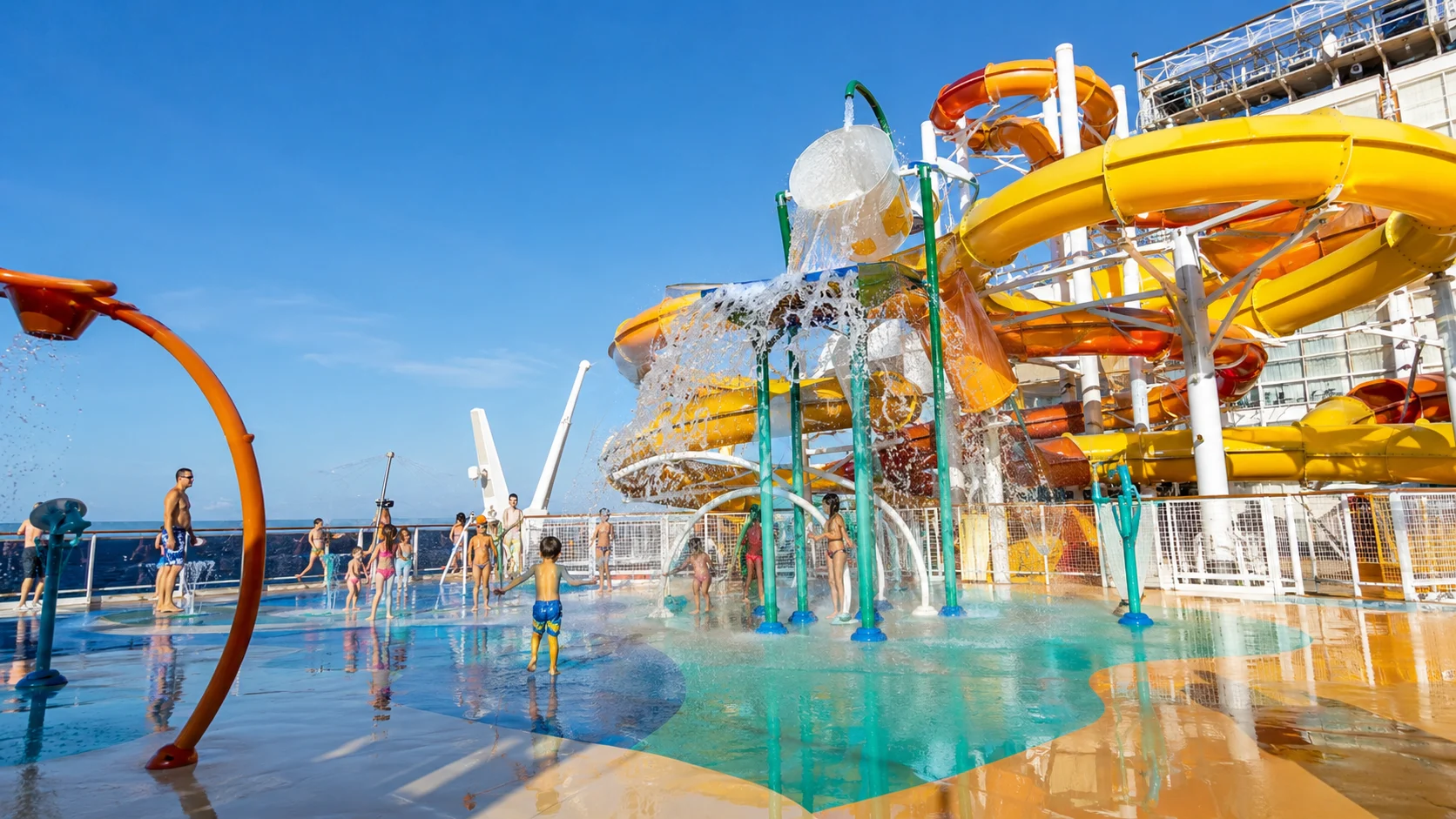 Colorful cruise ship water park with splash fountains and twisting slides