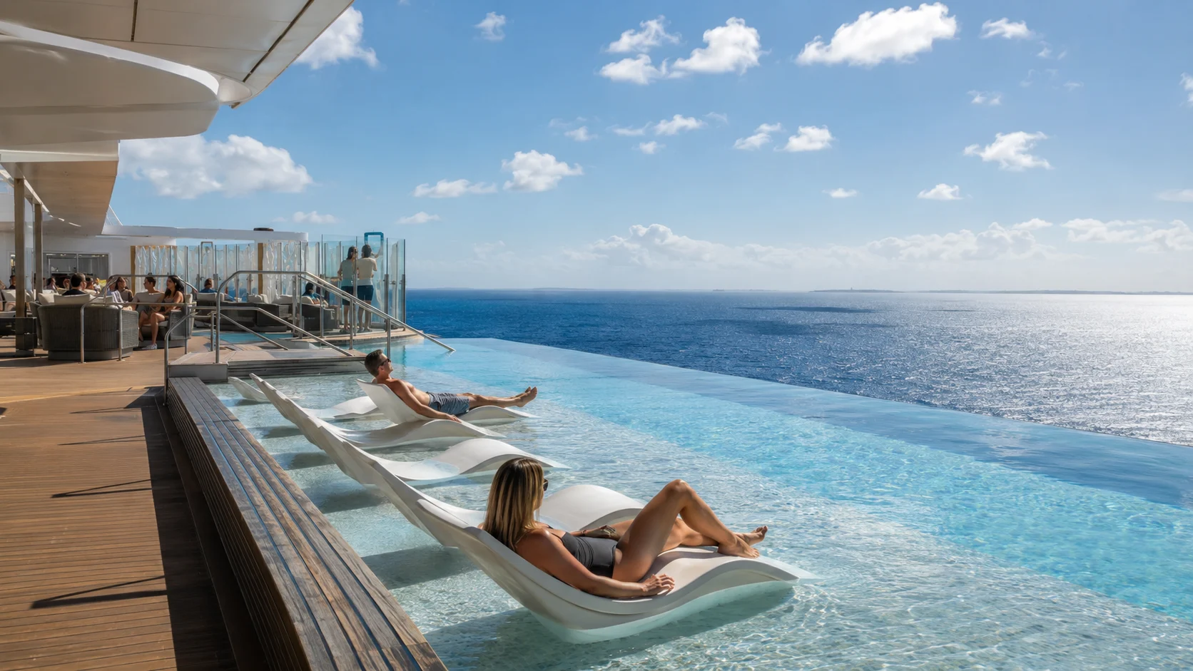 Infinity pool and loungers overlooking the wake on Norwegian Viva