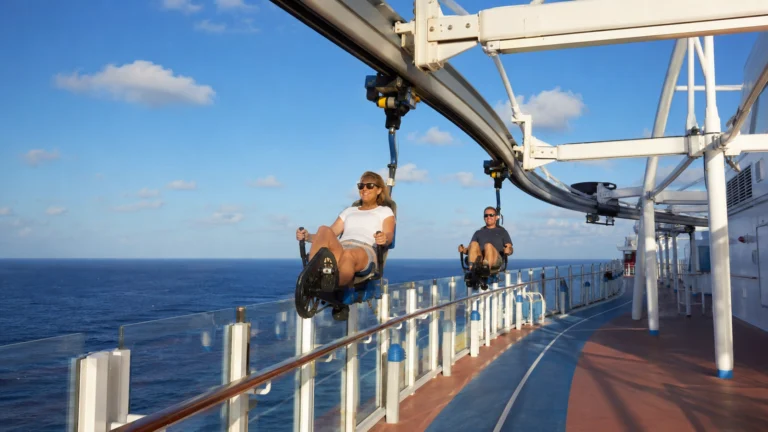 Guests riding the SkyRide high above Carnival Horizon's deck