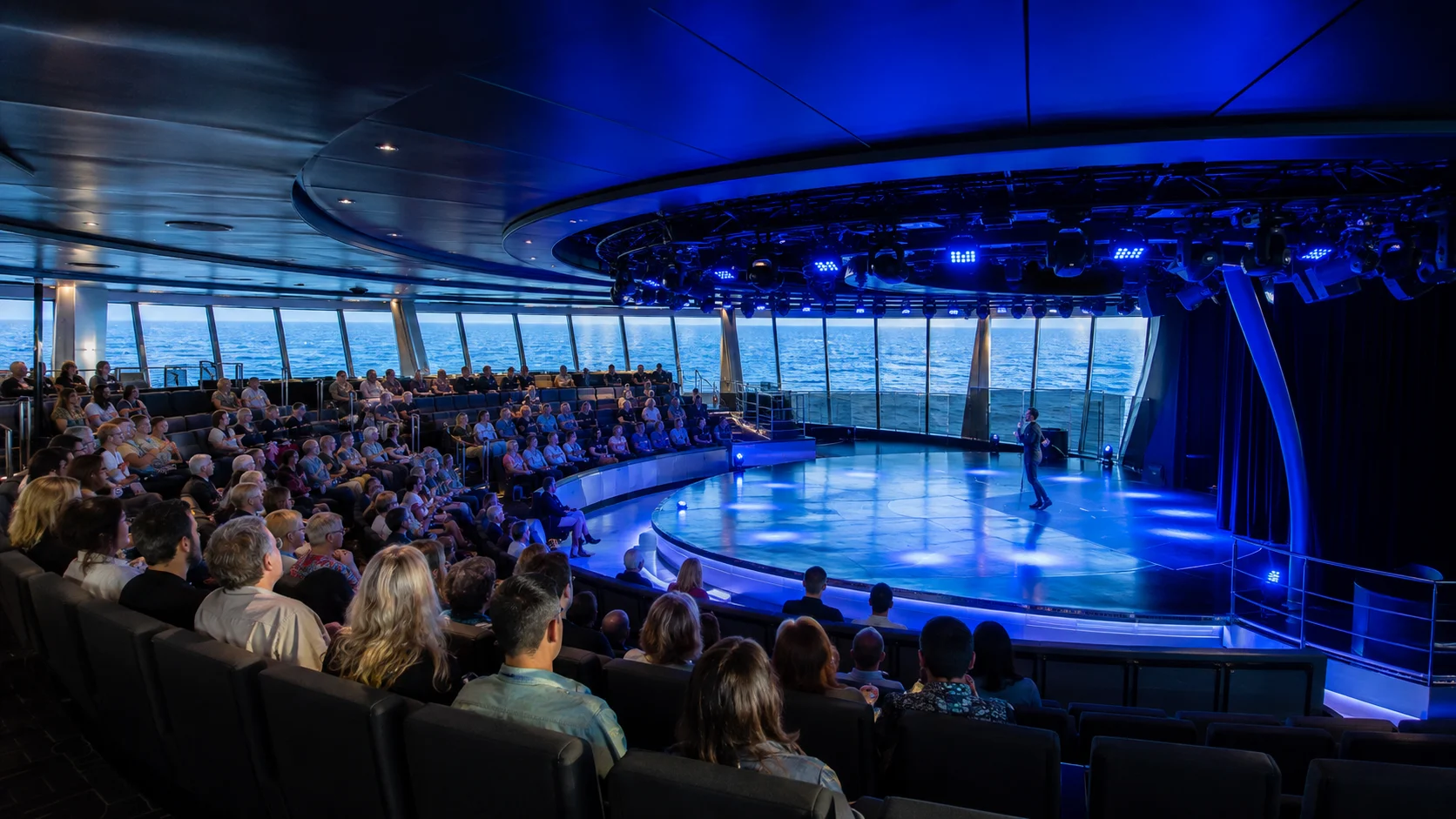 Blue-lit performance inside Carousel Lounge aboard MSC Meraviglia