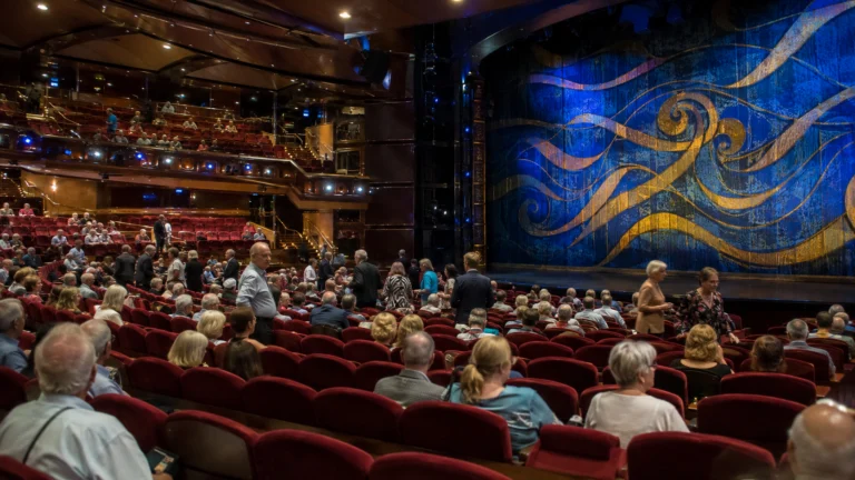 Audience watching a stage show in the Caribbean Princess theater