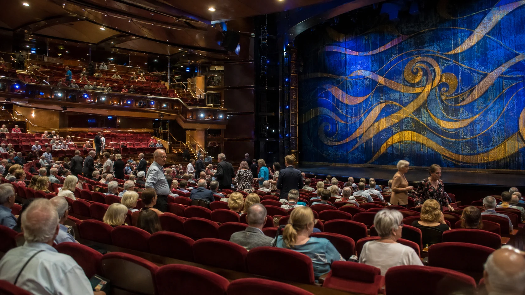 Audience watching a stage show in the Caribbean Princess theater