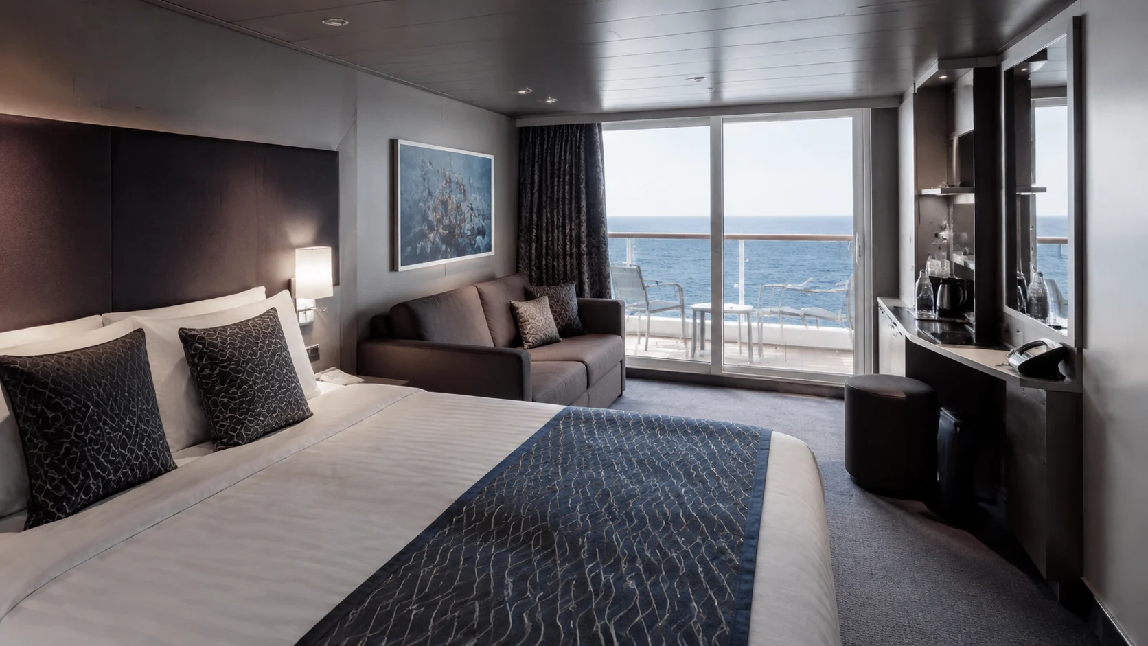Modern balcony cabin with a gray bed runner and wide picture window