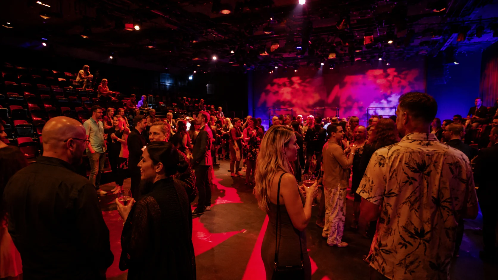 Crowd watching a performance in The Red Room on Resilient Lady