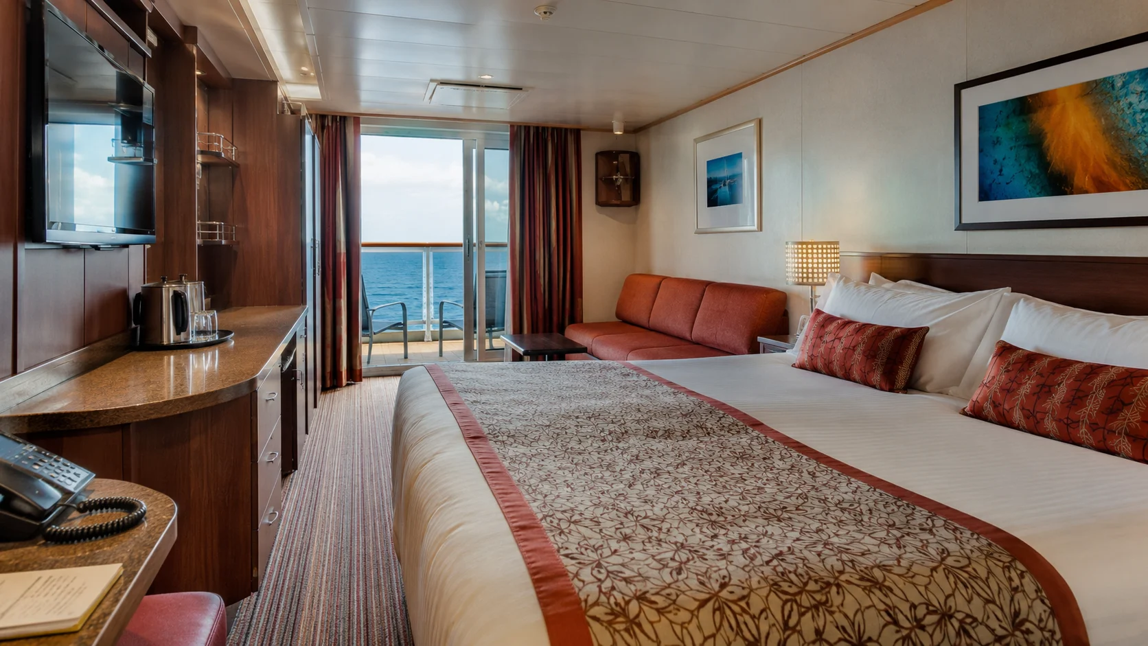 Carnival Horizon balcony cabin with a sofa and ocean view