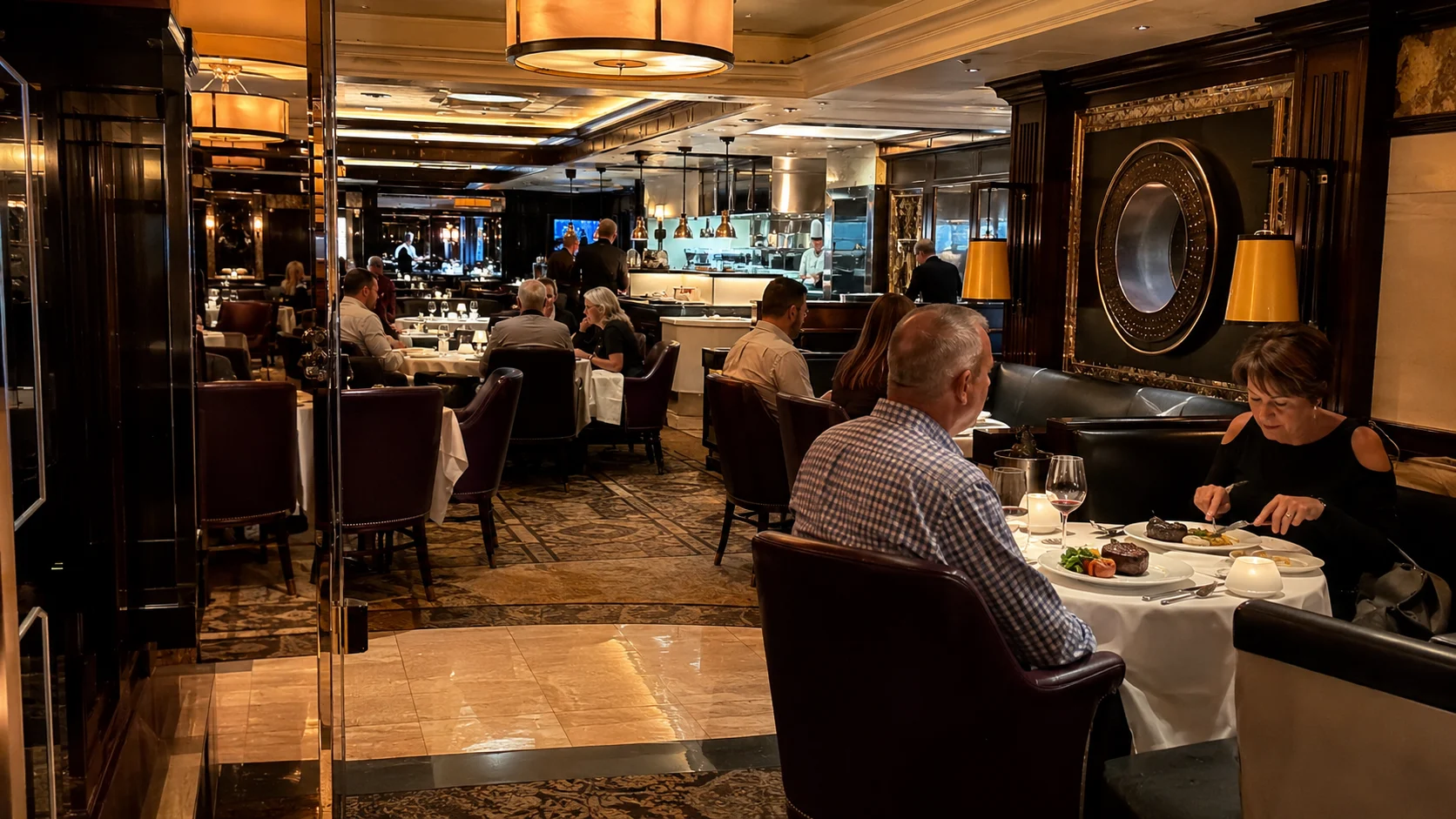 Guests dining in an upscale dark wood-paneled restaurant