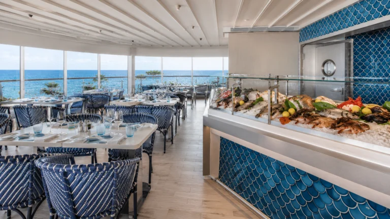 Bright ocean-view restaurant with a chilled seafood counter