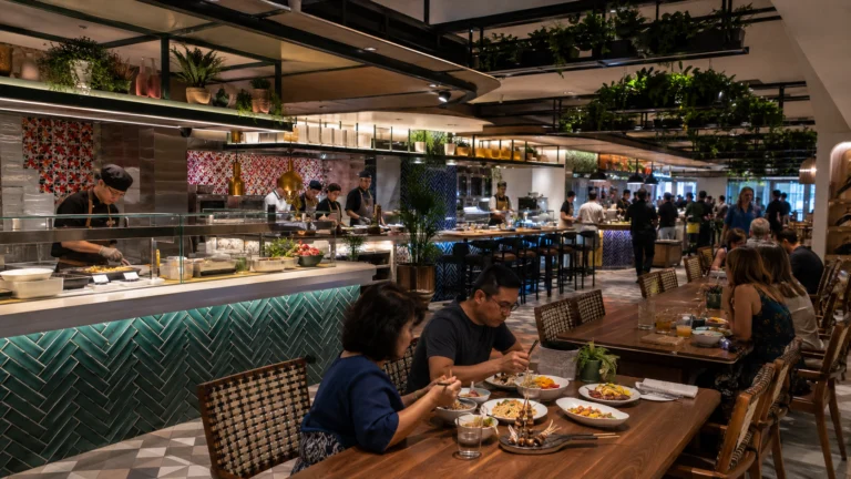 Guests dining in the Indulge Food Hall on Norwegian Viva