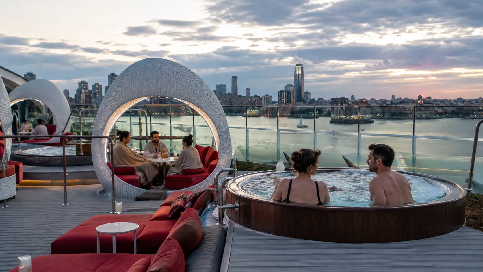 Guests relaxing in hot tubs at Richard's Rooftop with city views