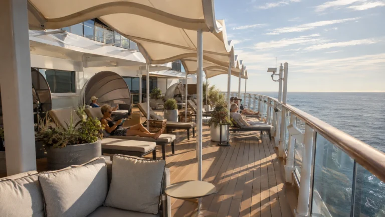 Quiet upper-deck lounge seating beneath white canopies