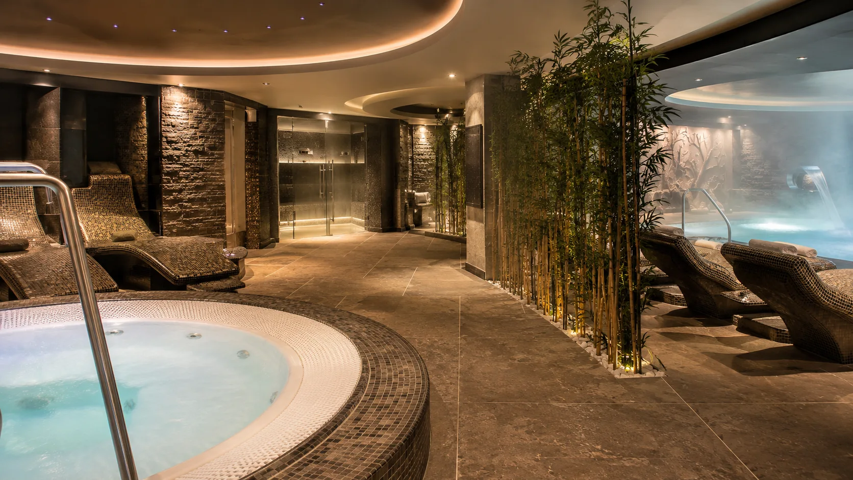 Whirlpool and heated loungers inside MSC Aurea Spa on MSC Meraviglia