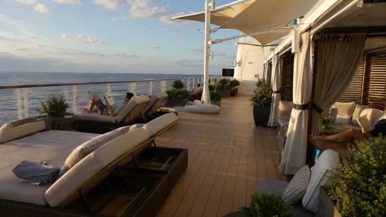 Private sun deck cabanas and loungers overlooking the ocean
