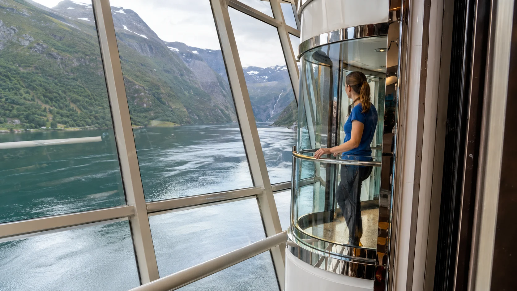 Glass elevator overlooking a Norwegian fjord aboard Brilliance of the Seas