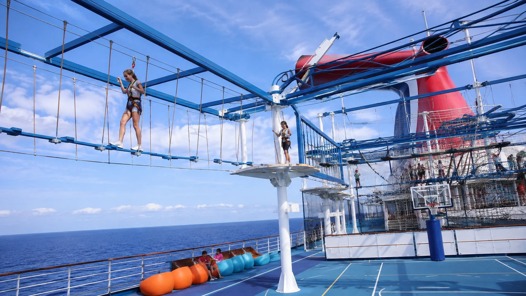 Guests crossing the ropes course aboard Carnival Breeze