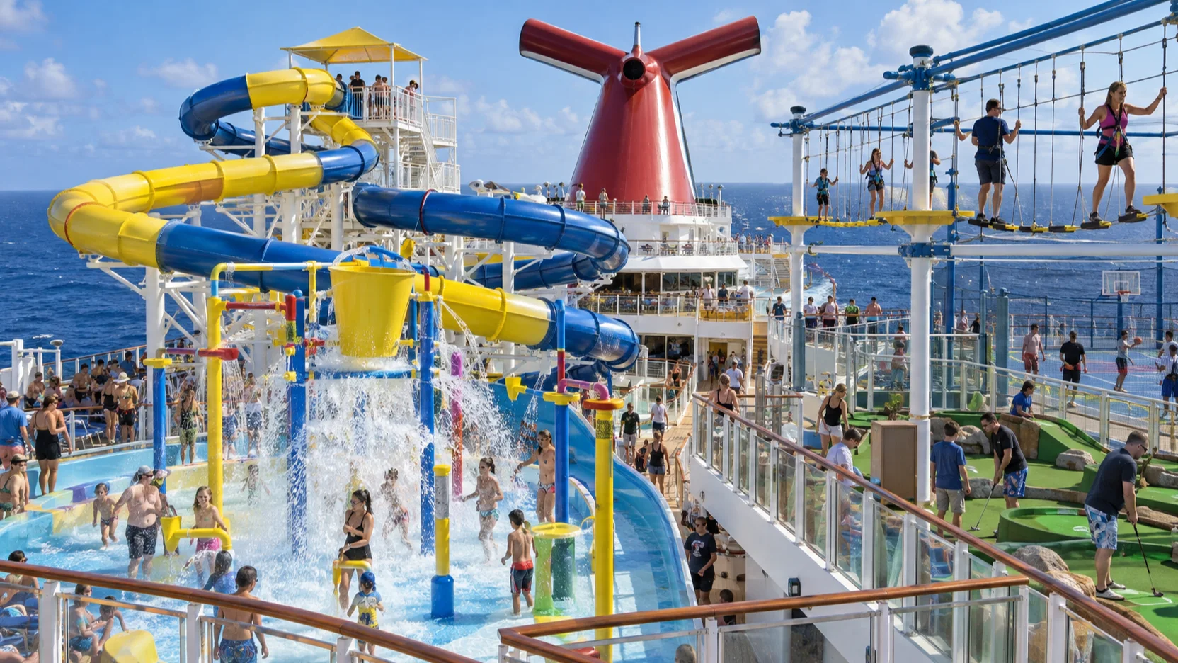 Guests enjoy twisting waterslides and a high ropes course at Carnival Magic's colorful WaterWorks and SportSquare.