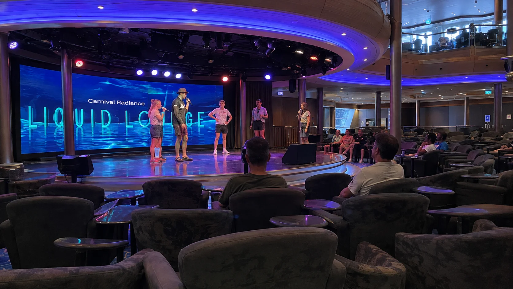 Performers onstage in the main show lounge aboard Carnival Radiance