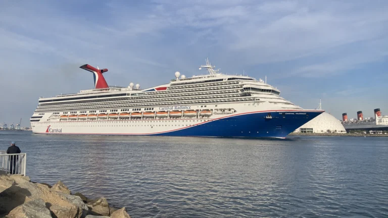 Carnival cruise ship passing through a harbor