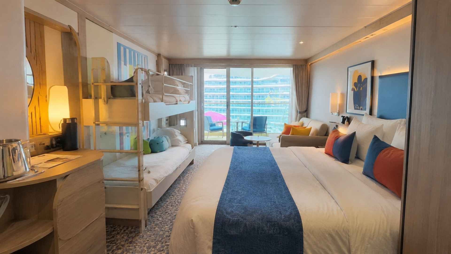 A family balcony cabin with bunk beds along one wall