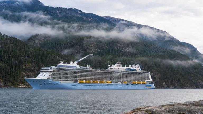 Ovation of the Seas sailing through misty Alaskan mountains
