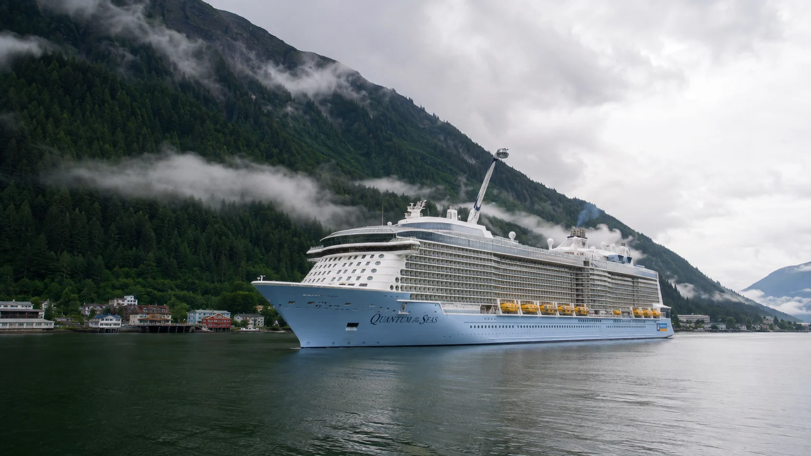 Quantum of the Seas sailing through a misty Alaskan fjord
