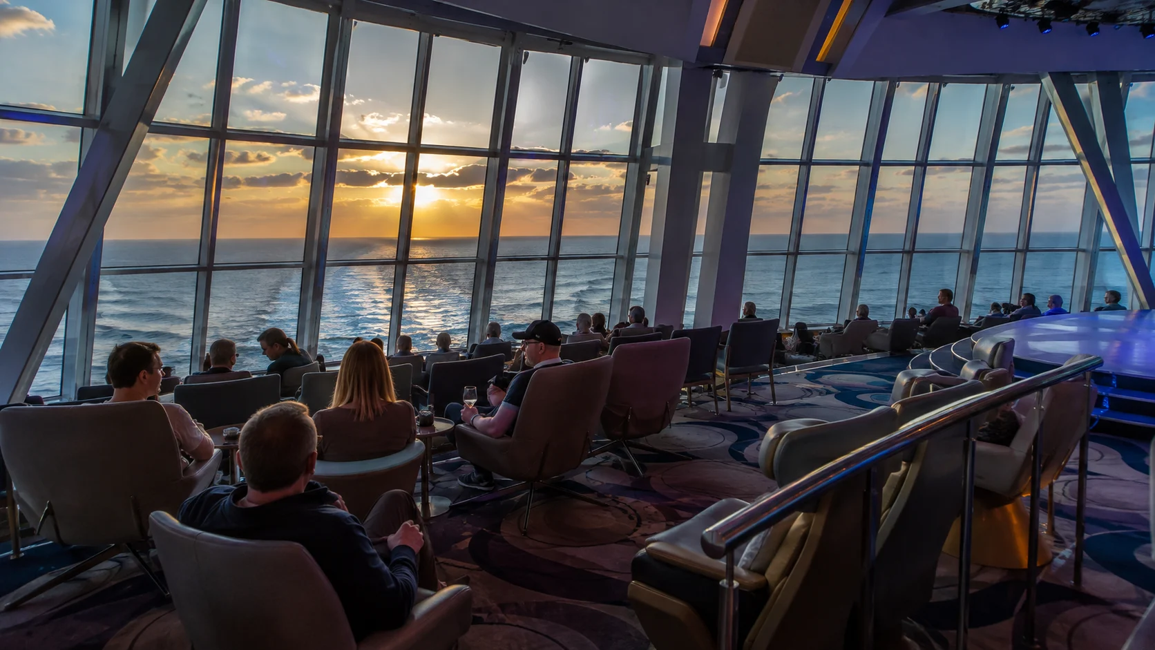 Two70 lounge overlooking the ocean at sunset aboard Quantum of the Seas