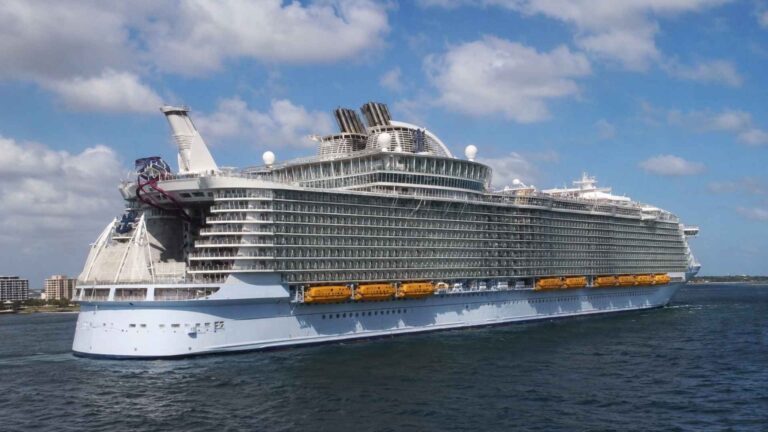 Symphony of the Seas at sea off a coastline