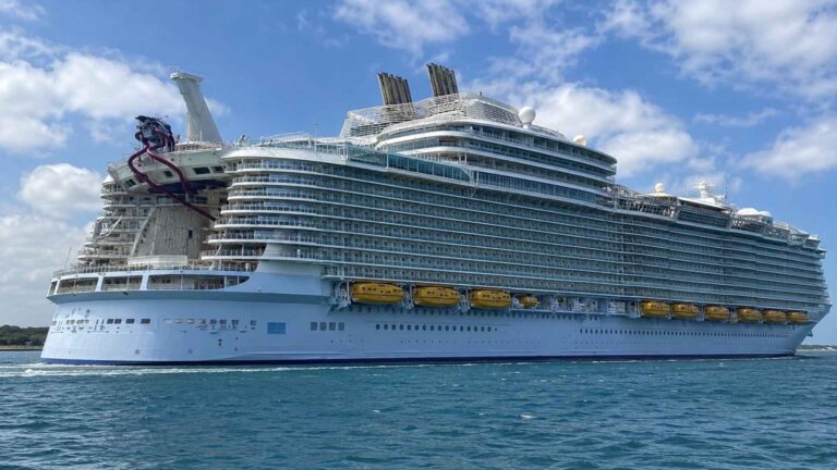 Utopia of the Seas at sea under a clear blue sky