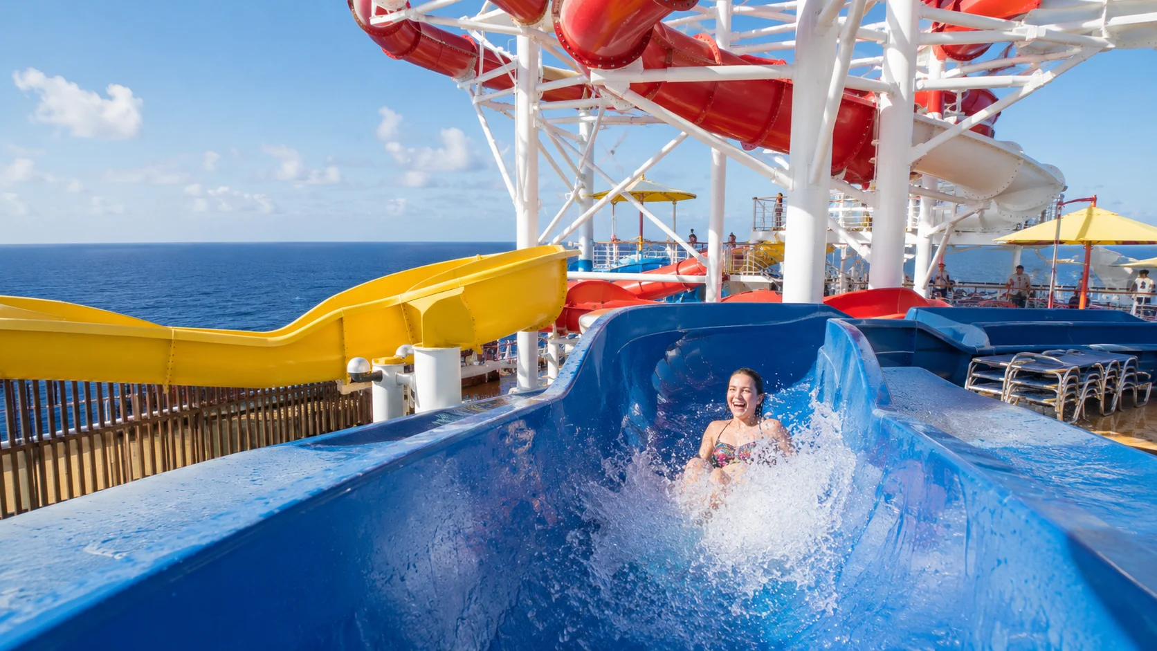 Guest splashing down a WaterWorks slide aboard Carnival Breeze
