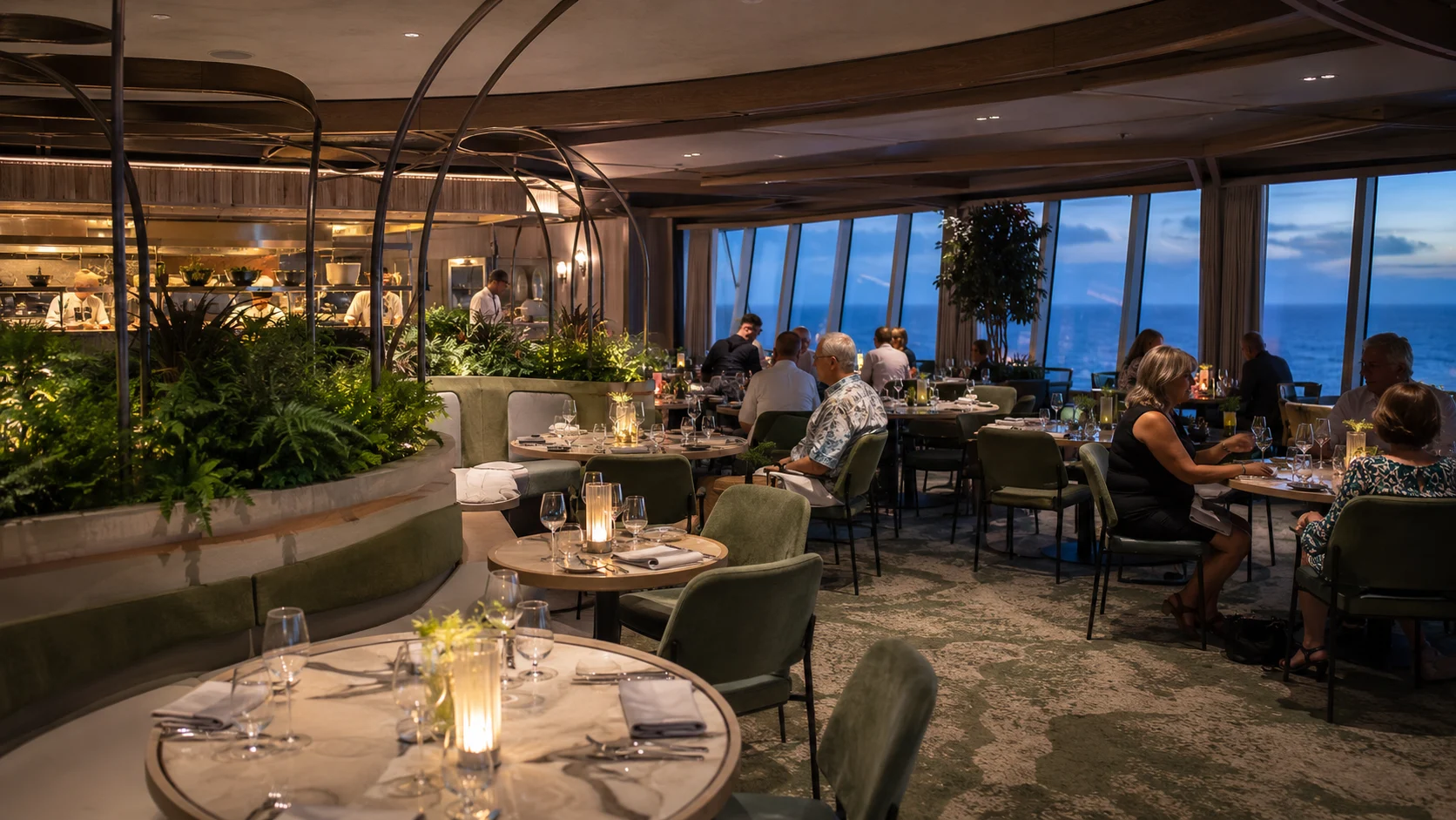 Guests dining among greenery at Eden Restaurant aboard Celebrity Apex