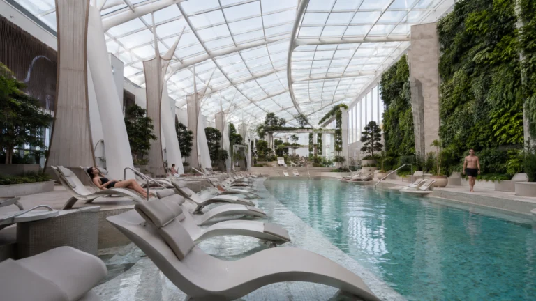 Indoor pool and loungers in the Celebrity Ascent Solarium