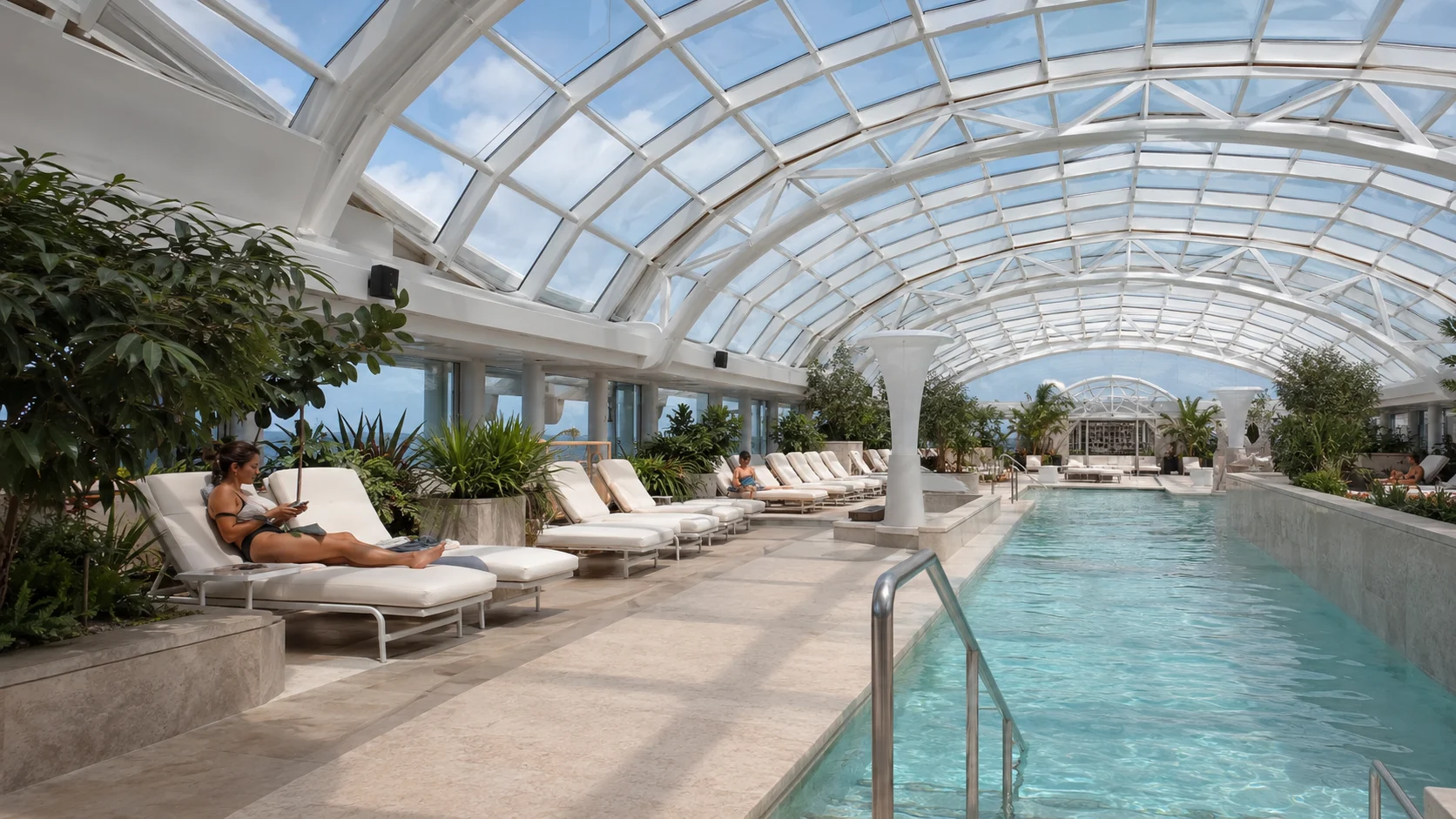 Indoor pool and loungers in the Celebrity Edge Solarium