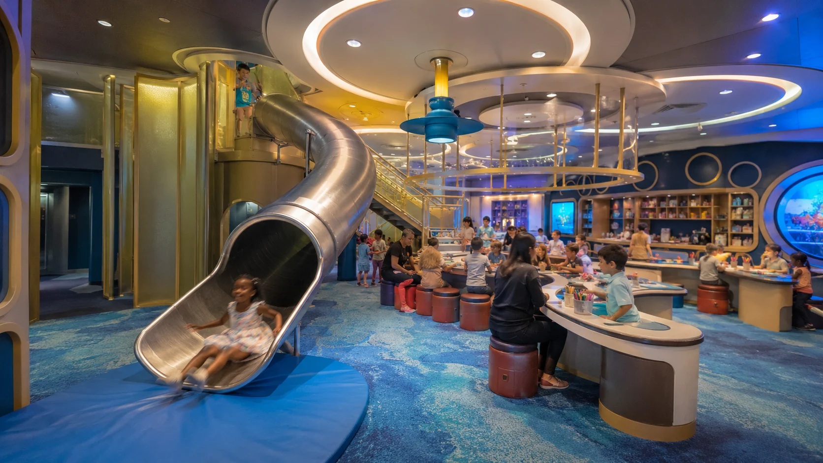 Child sliding into Disney's Oceaneer Club aboard Disney Wish