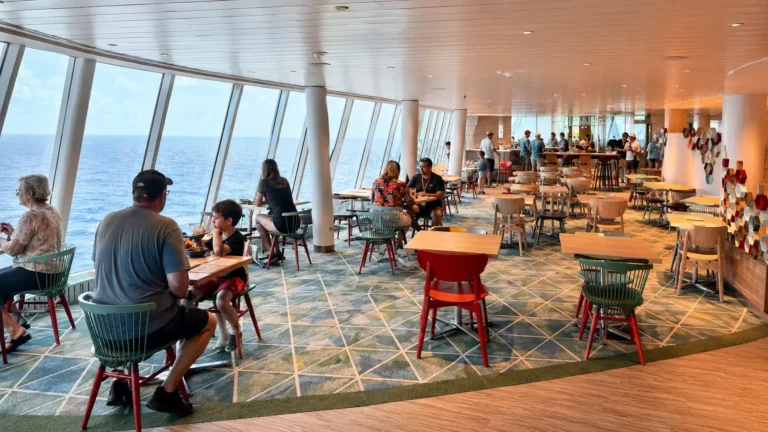 Food hall seating inside AquaDome Market aboard Icon of the Seas