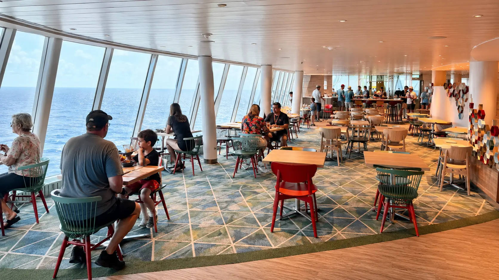 Food hall seating inside AquaDome Market aboard Icon of the Seas