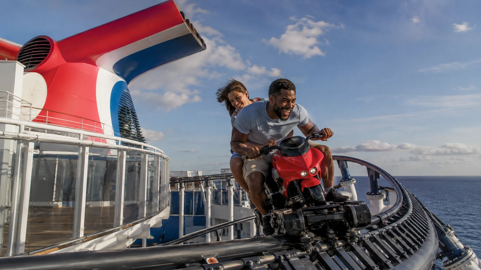 Riders on the BOLT roller coaster aboard Mardi Gras