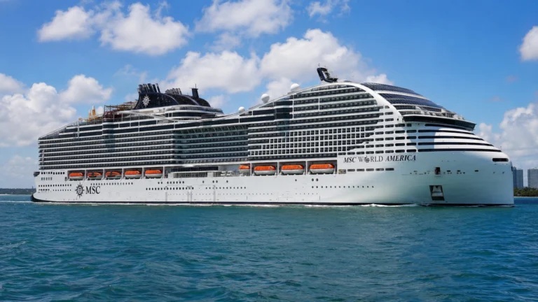 MSC World America sailing across bright blue water