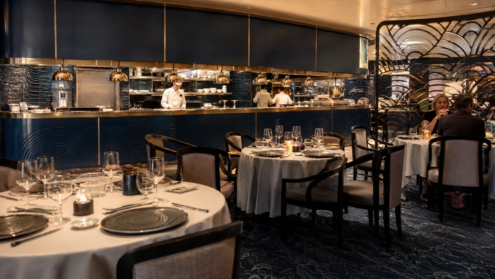 Dining tables inside Ocean Blue restaurant aboard Norwegian Encore