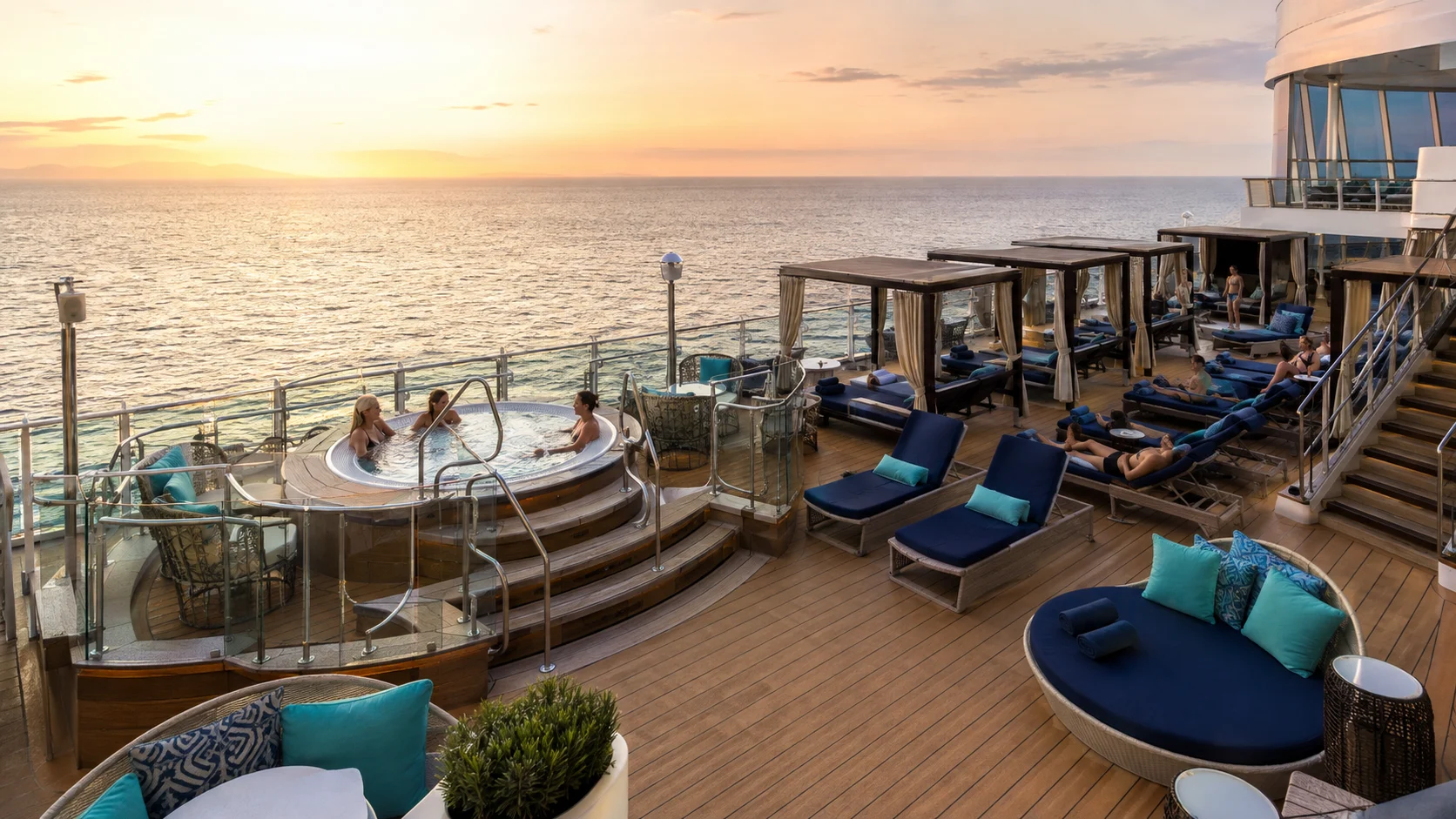Vibe Beach Club loungers and whirlpool aboard Norwegian Encore at sunset
