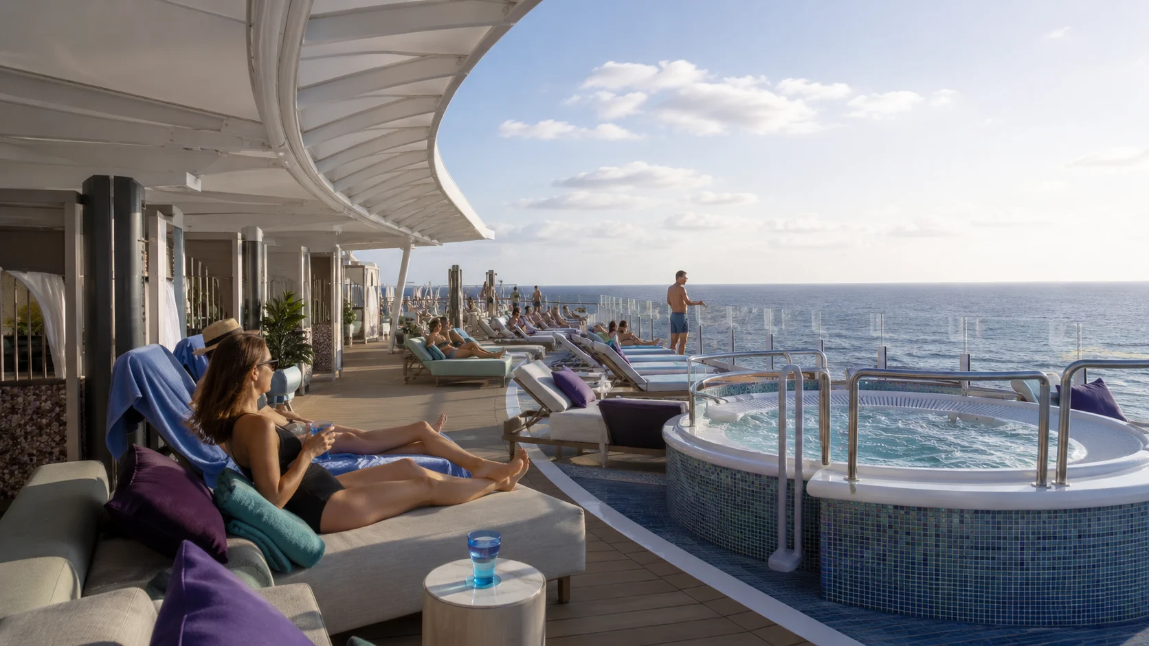 Ocean-view whirlpool and loungers at Vibe Beach Club aboard Norwegian Luna