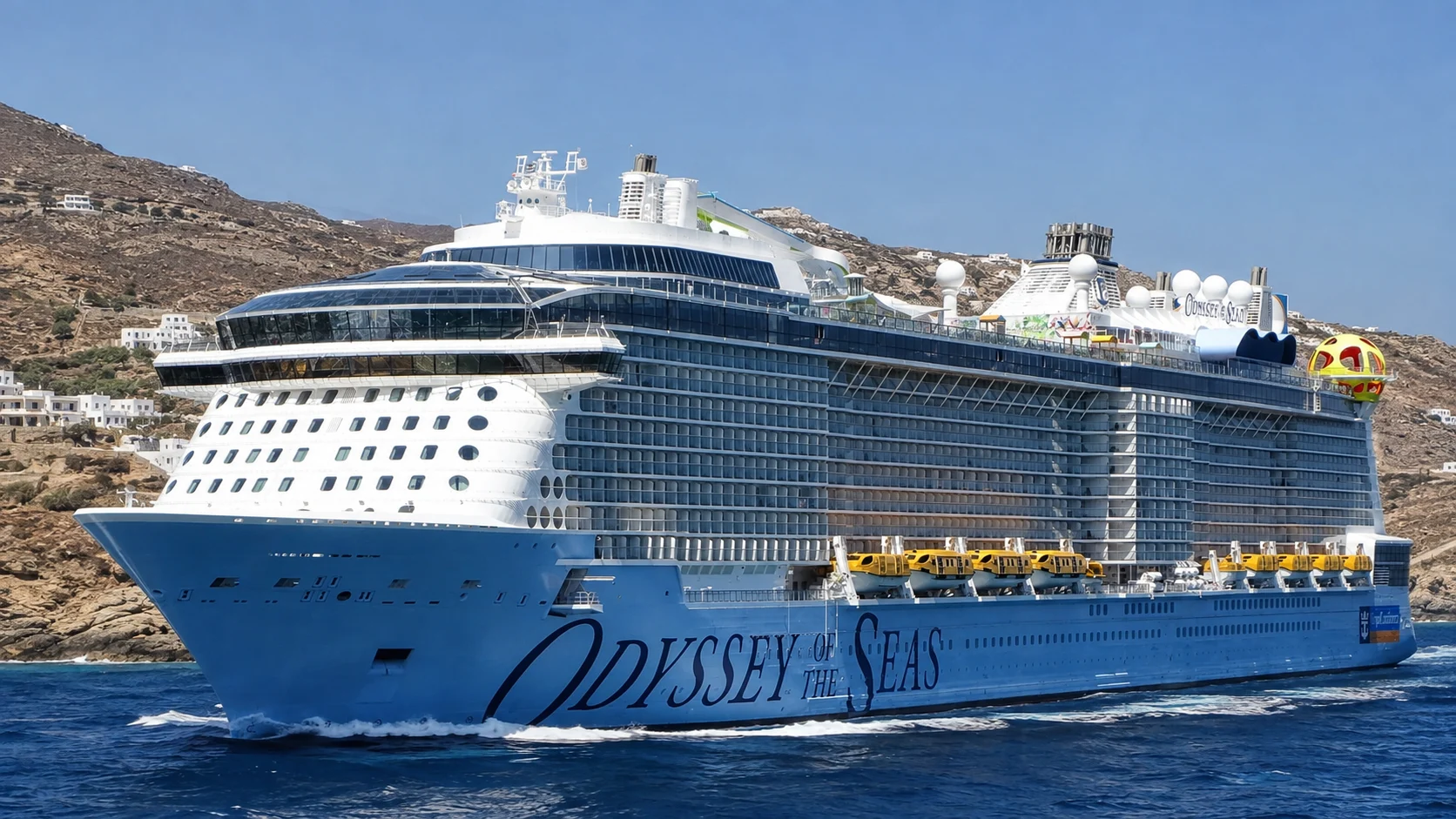 Odyssey of the Seas sailing near a rocky coast